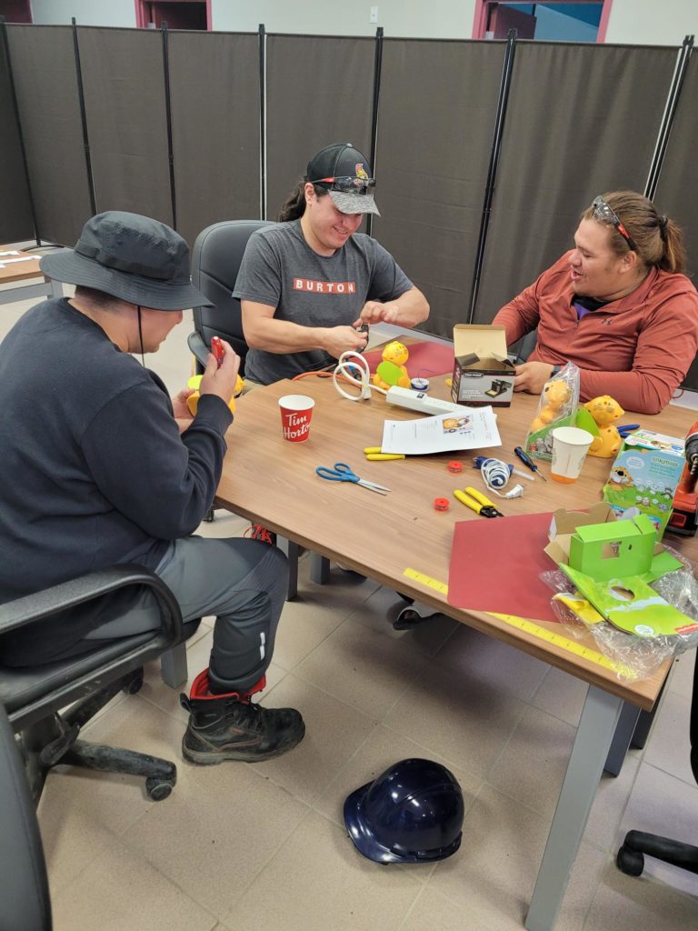 Three participants switch-adapted toys.