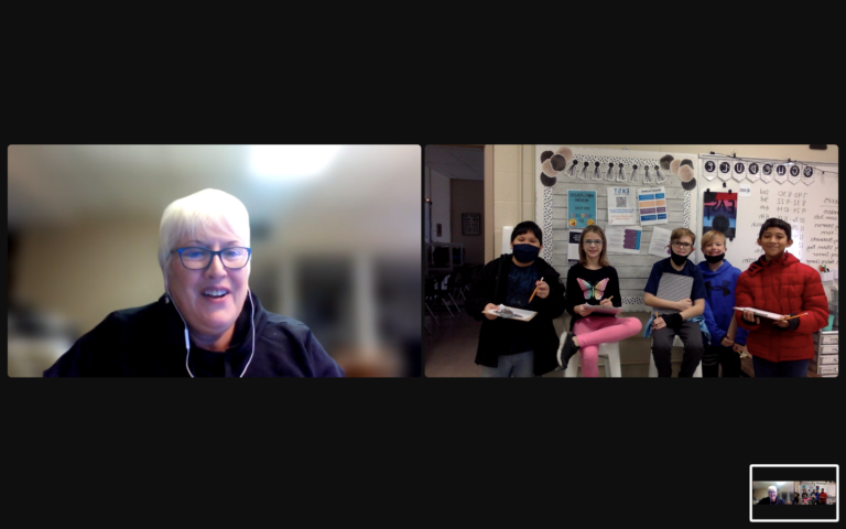 A zoom screen capture of Suzanne, MMC staff, and children posing with built devices.
