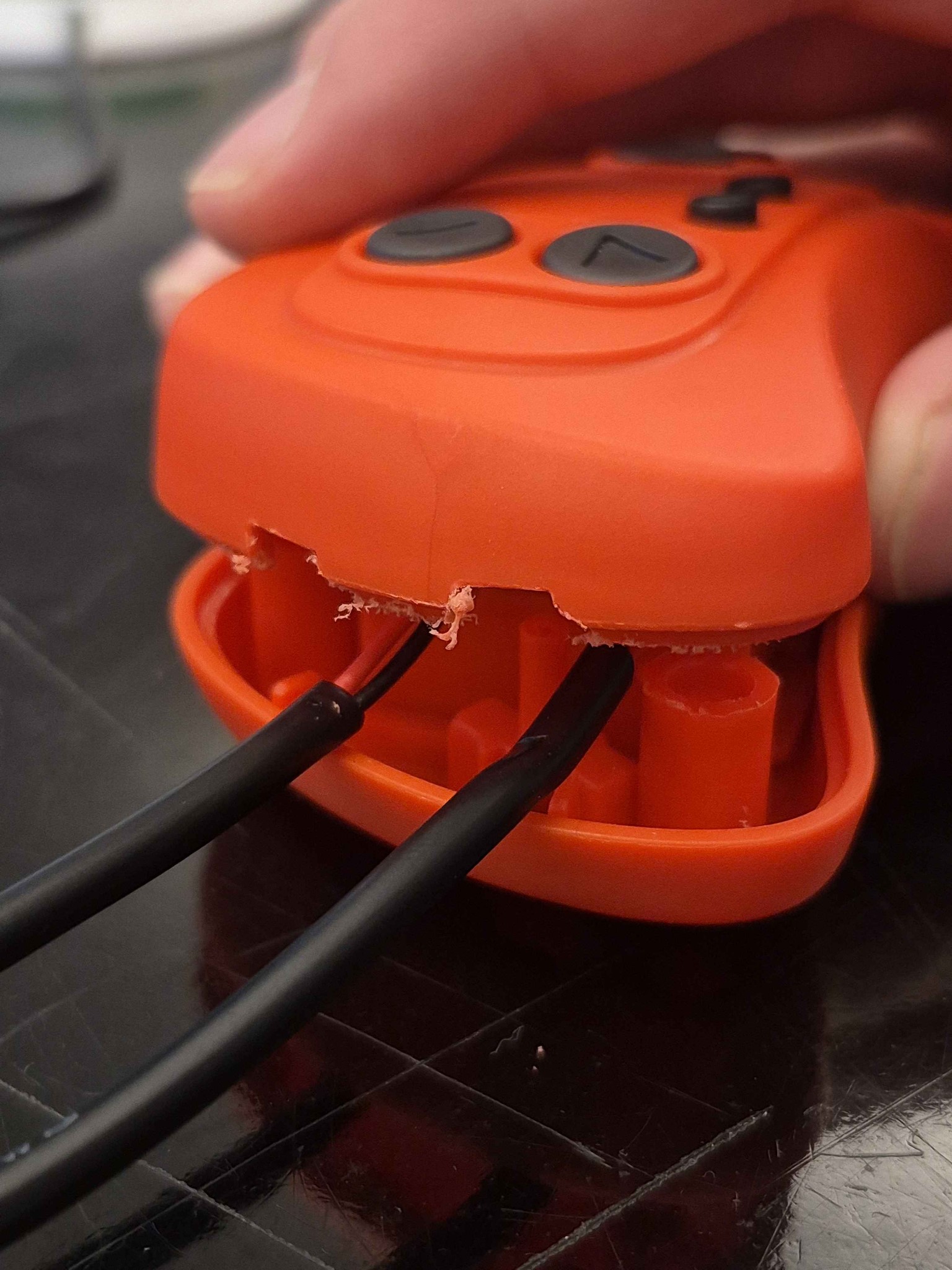 A maker puts together a switch adapted controller.