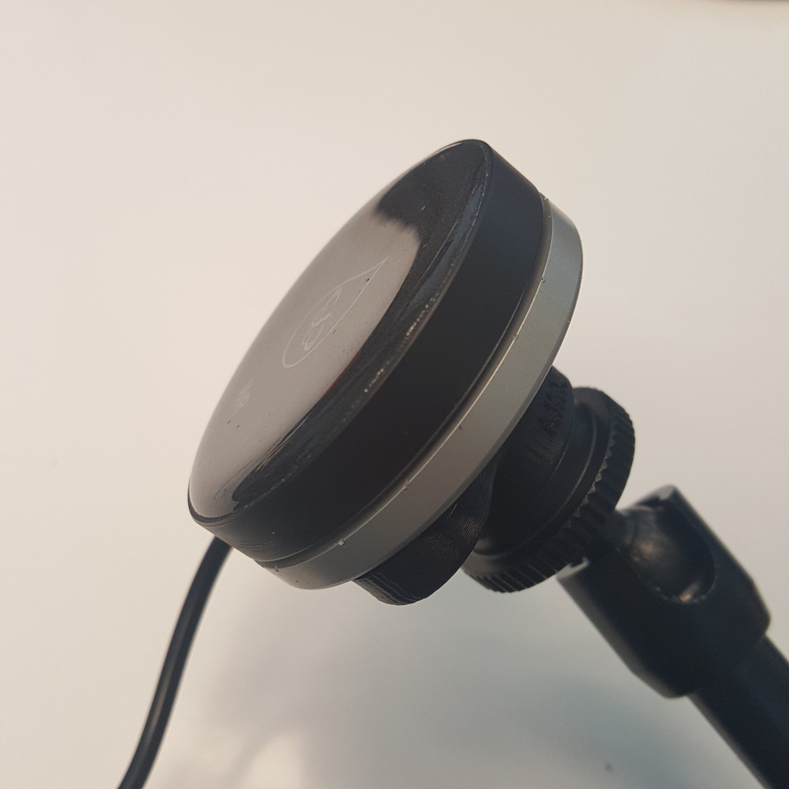 PIKOButton mounted to a mount adapter and an adjustable arm