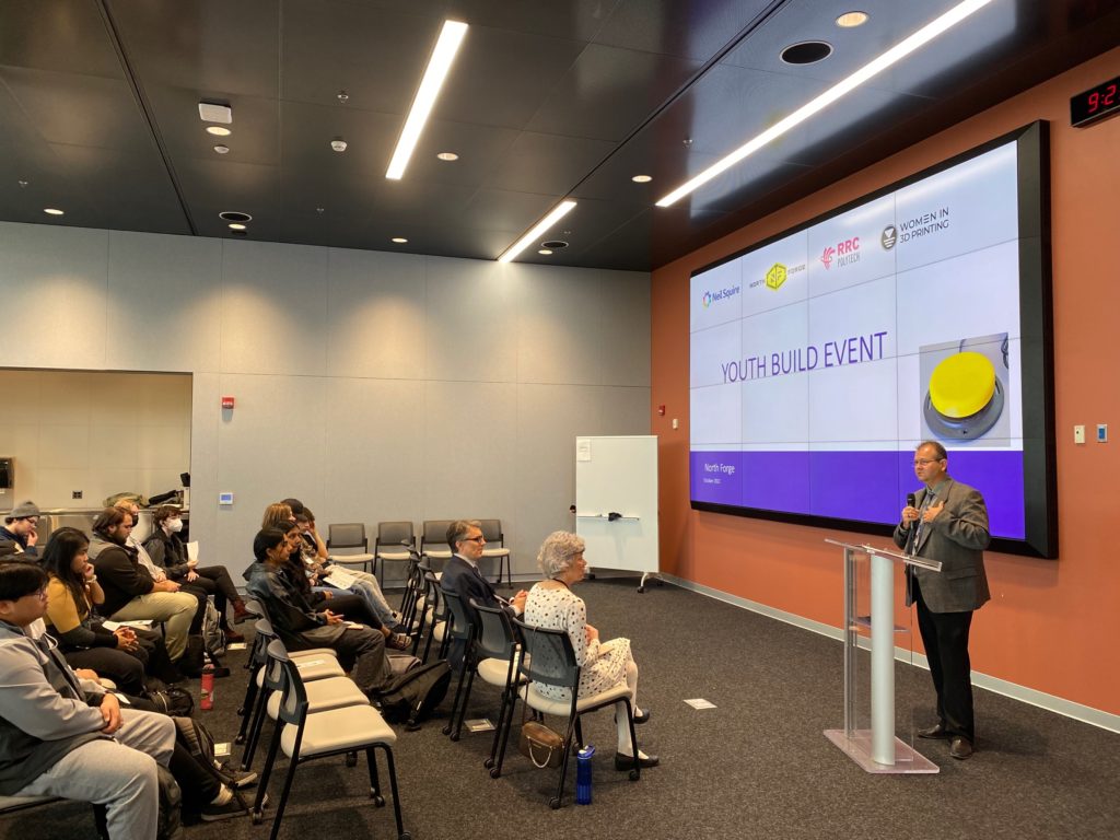 A presenter delivering a presentation to a group of participants.