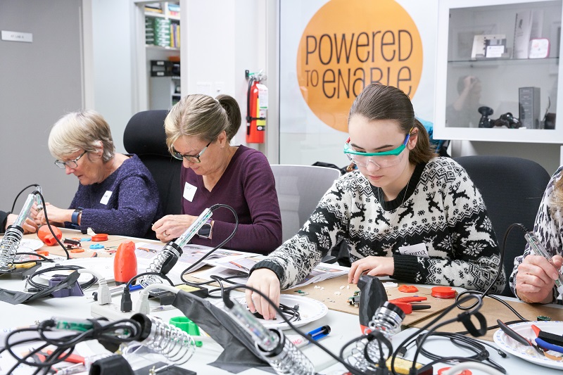 Participants building the LipSync device.