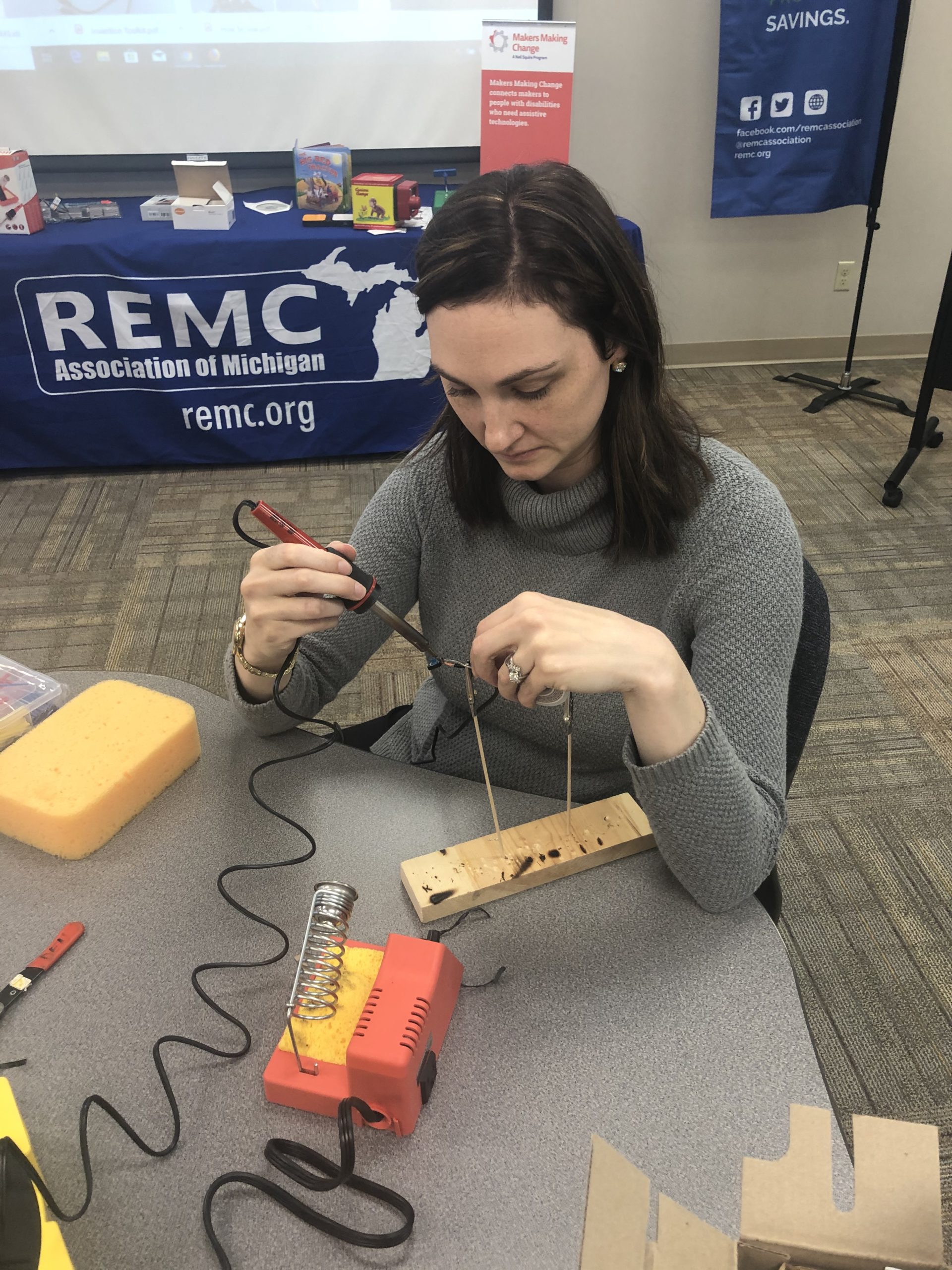 A volunteer soldering.