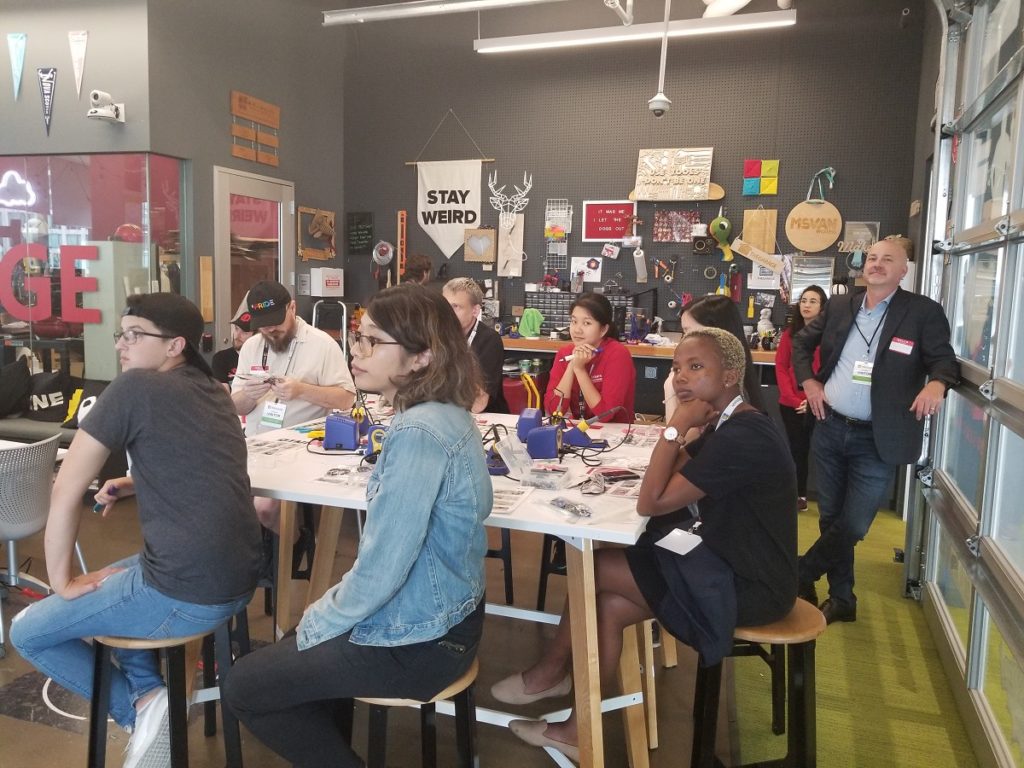 A group photo of makers at a build event.