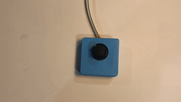 A GIF video of a person toggling a blue 'Cedar" joystick.