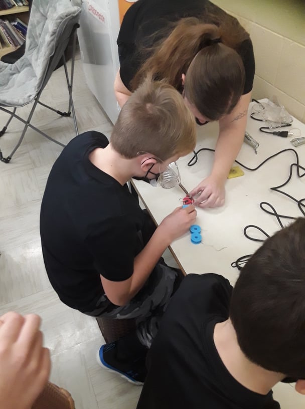 A child building assistive tech.