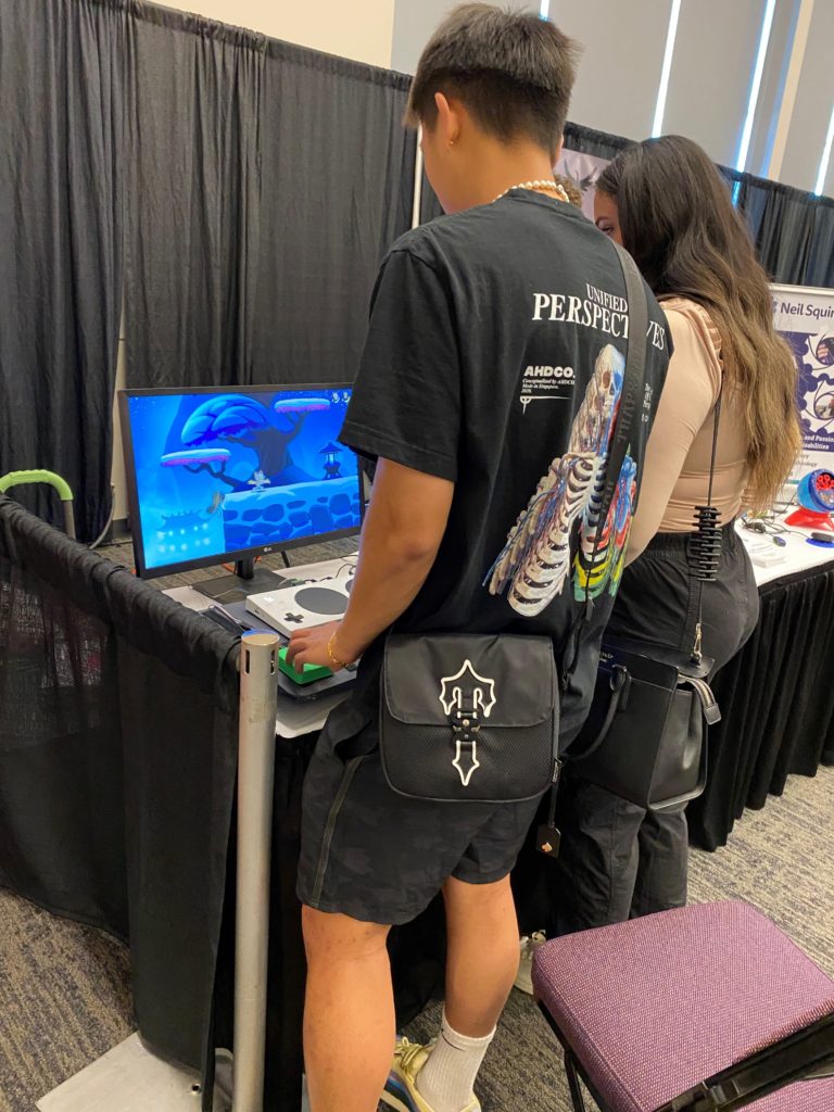 Two users adaptive gaming at our booth.